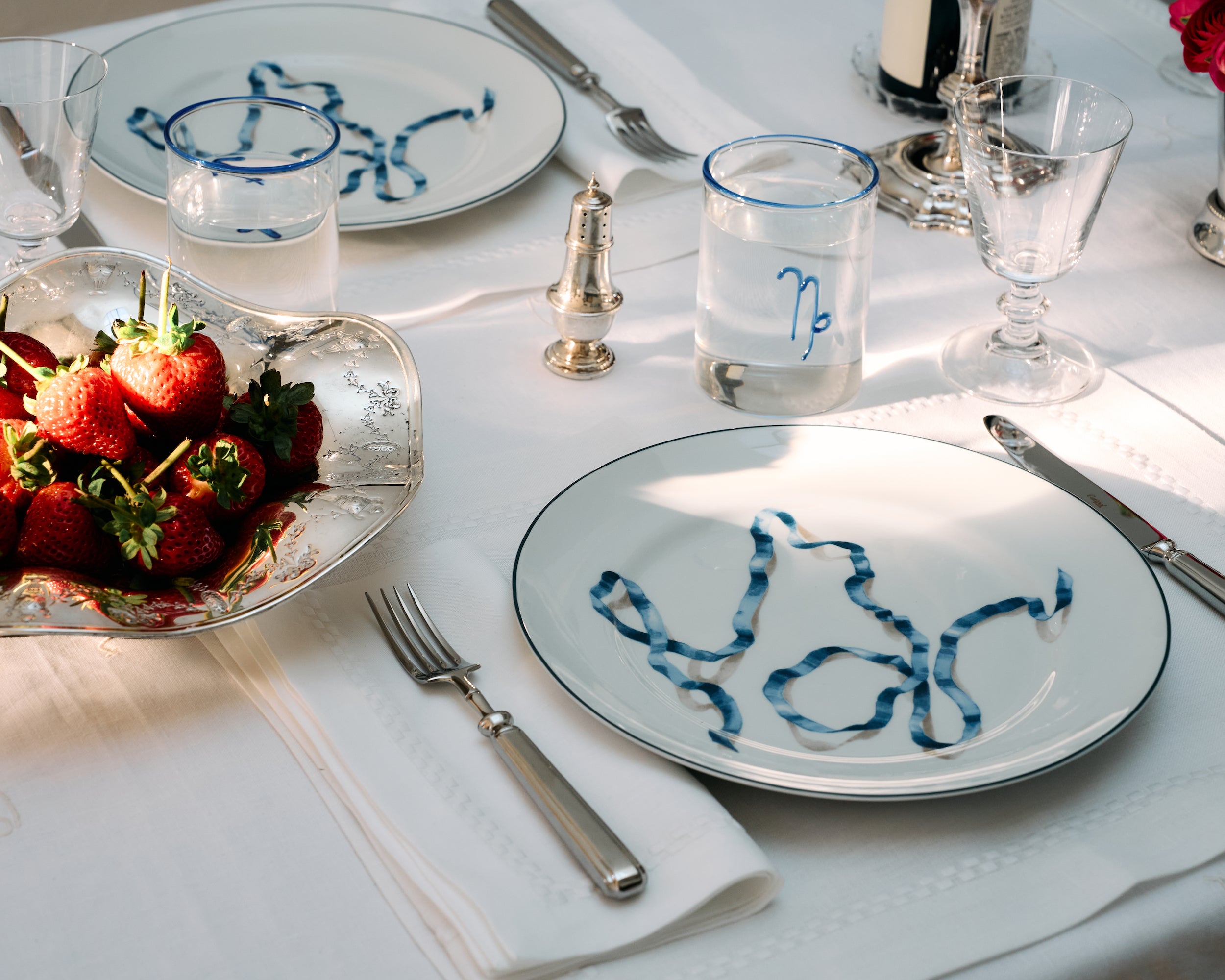 A set of four blue ribbon dinner plates. Harper’s Bazaar Best Hostess Gifts for Dinner Parties, Movie Nights, and More. These ribbon-adorned dinner plates can transform even an easy meal into something fit for a downtown It-girl. With three different colors to choose from, you can find the perfect option for home design lovers.