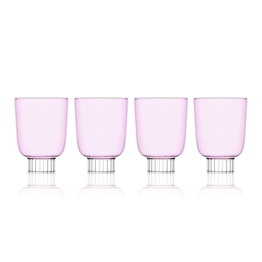 Set-of-four blush pink colored winery glasses. Sprezz's colored stemware and safe glassware are handmade and dishwasher safe, making them the perfect unique touch to any effortless dinner party.