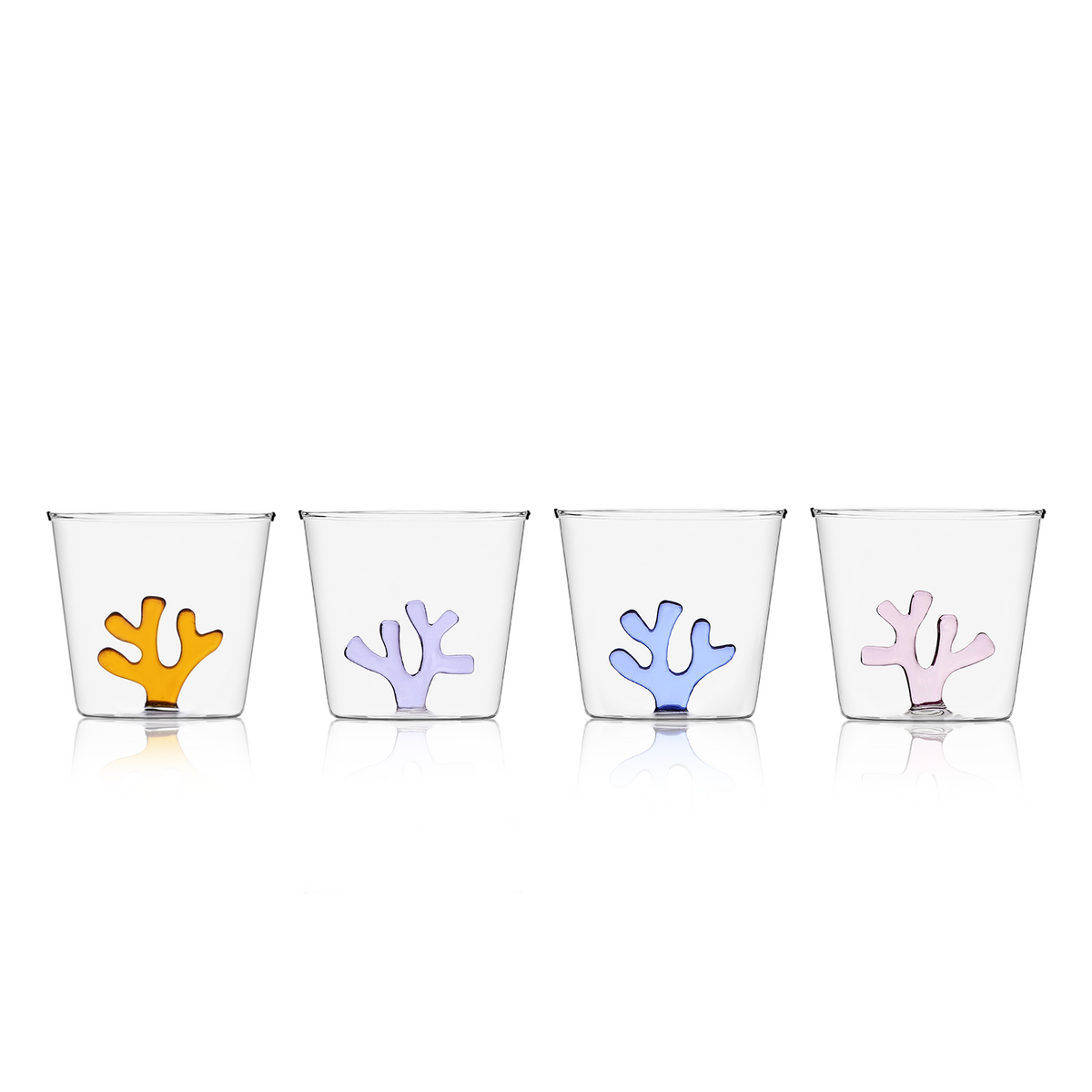 Four all-purpose clear hand-blown glasses feature a colourful coral on the inside. The glasses are available in amber, lilac, blue, blush pink.