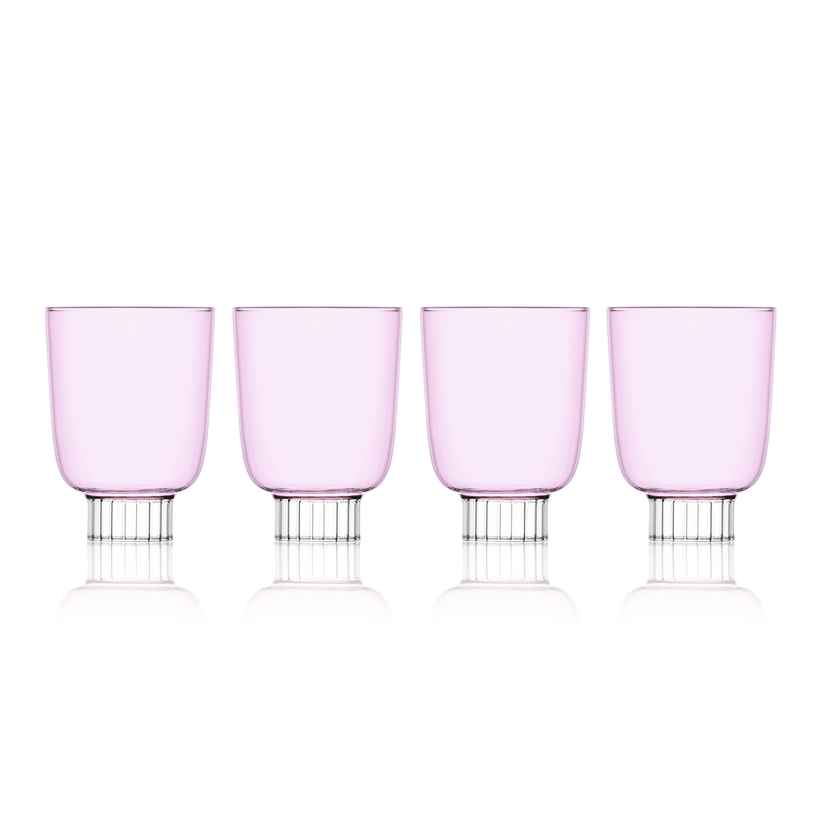 Set-of-four blush pink colored stemless wine glasses. Sprezz's colored stemwareare handmade and dishwasher safe