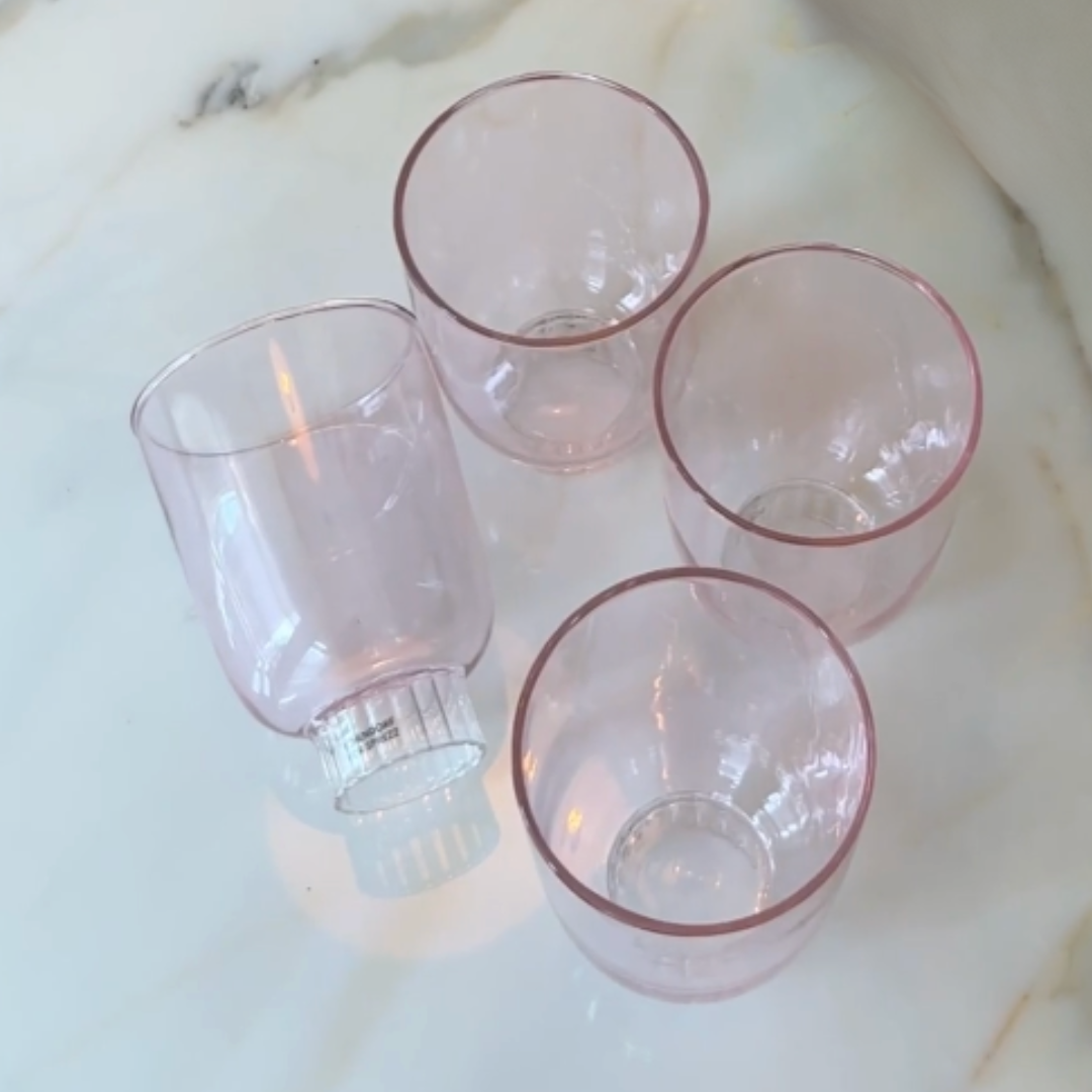 blush pink colored wine stemware